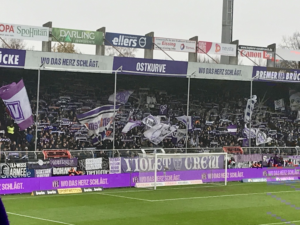 Fans of VfL Osnabrück waving flags before a match